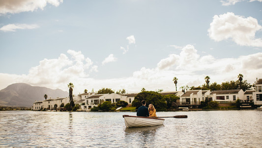 Couple sitting in a boat on a romantic date