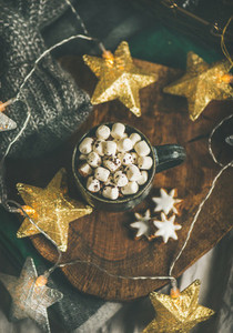 Christmas winter hot chocolate with marshmellows over wooden board