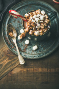 Christmas hot chocolate with marshmallows and candy cane copy space