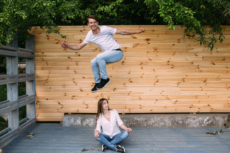 couple posing on a background of the wooden wall