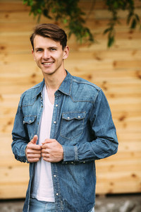 young handsome man in a denim shirt