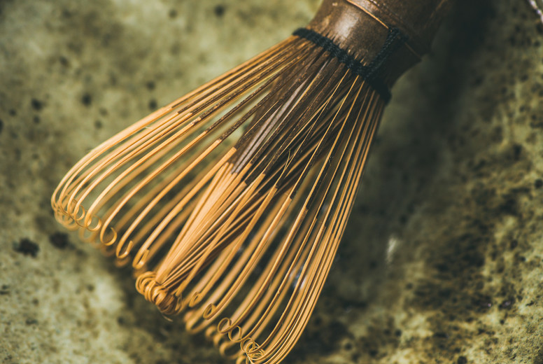 Chasen bamboo whisk, Chawan bowl over grey background, square crop