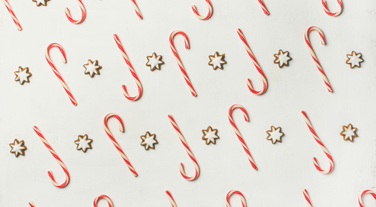 Christmas holiday food pattern with candy cane and cookies  top view