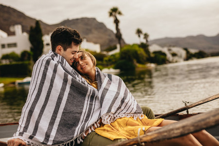 Couple sitting in a boat on a romantic date
