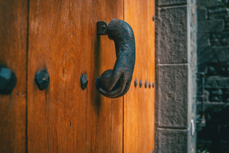 An old metal knocker shaped like a hand