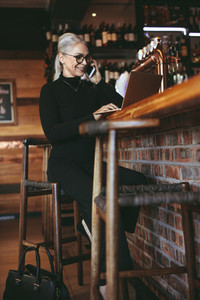 Businesswoman working from a coffee shop