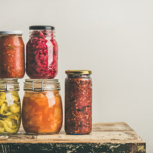 Autumn seasonal pickled or fermented vegetables in jars  Home canning