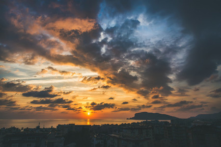 View of sunset over sea and evening dramatic sky Alanya