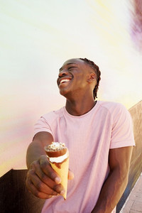 Young man eating and ice cream