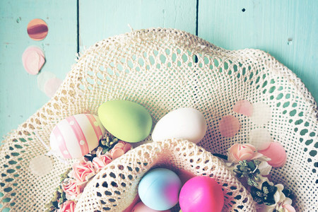 A beautiful and colorful close up flat of easter eggs in plain p