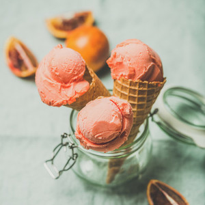 Refreshing summer blood orange ice cream and fruits square crop