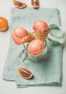 Refreshing summer blood orange ice cream and fresh orange slices