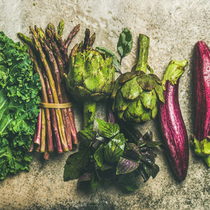 Flat lay of fresh green and purple vegetables  square crop