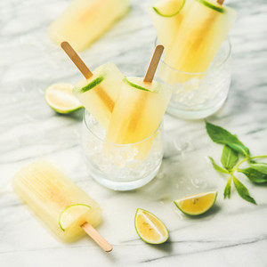 Summer refreshing lemonade popsicles with lime and mint