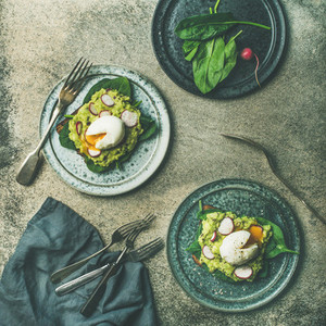 Healthy vegetarian wholegrain avocado toasts with poached egg square crop