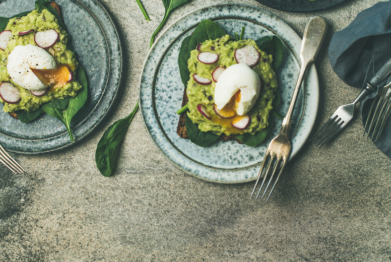 Healthy vegetarian breakfast flat-lay. Avocado and egg toasts, square crop