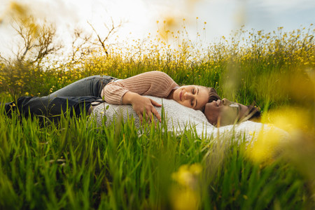 Young couple lying in meadow
