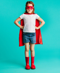 Cute girl in red superhero costume