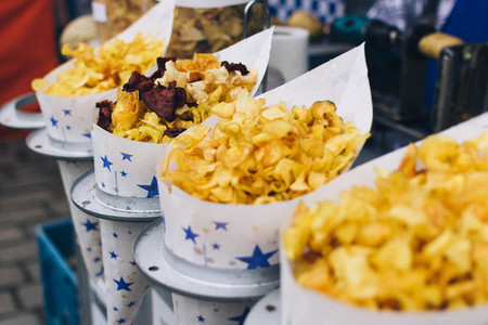 Cornets of fried chips at market