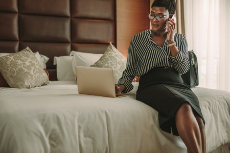 Woman CEO working in hotel room