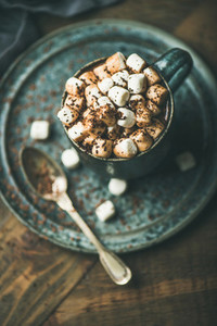 Winter warming sweet drink hot chocolate with marshmallows in mug