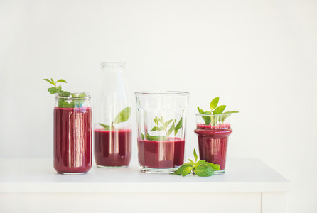 Fresh morning beetroot smoothie or juice in glasses with mint