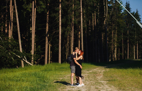 beautiful couple standing in a forest