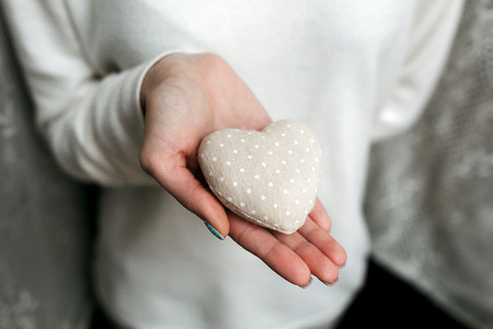 Girl holding a small lovely heart