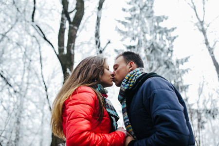Kiss in the winter forest