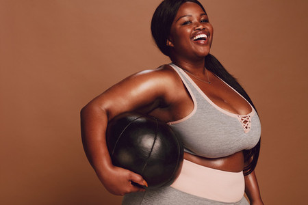 Plus size female with medicine ball