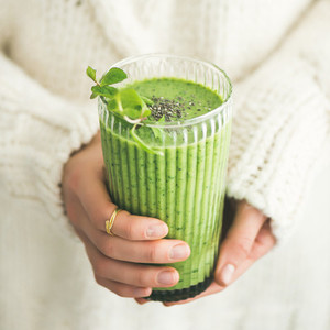 Matcha green smoothie with chia seeds and mint  square crop