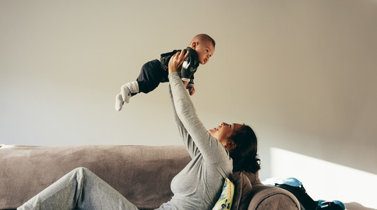 Woman spending time playing with her baby