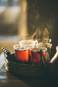 Traditional hot steaming Turkish tea in tulip glasses