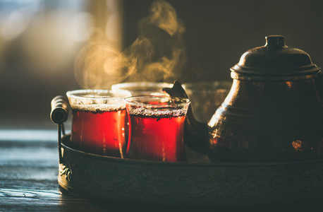 Traditional hot steaming Turkish tea in tulip glasses