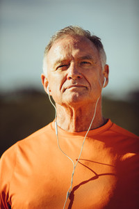 Portrait of a man listening to music
