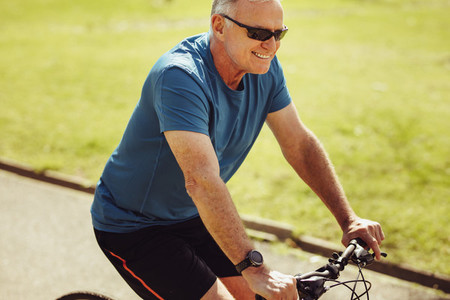 Senior man riding a bicycle for fitness