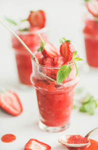 Strawberry and champaigne summer granita in glasses with mint leaves