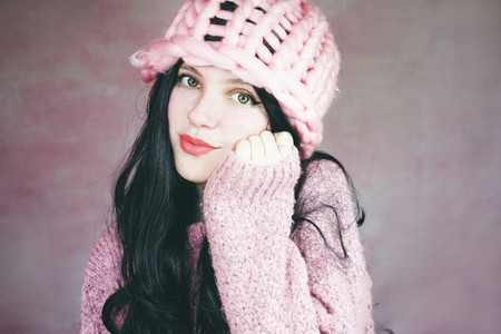 Beautiful and expressive brunette woman in pink