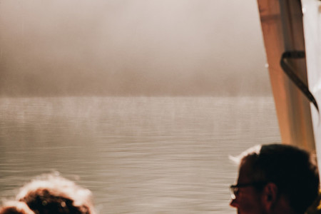 views from a boat of the border of the lake among fog