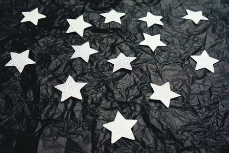 Fake sky night doing with silver stars and crumpled black paper