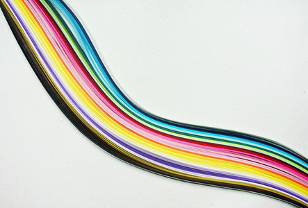 Rainbow doing with paper lines against a glitter white backgroun