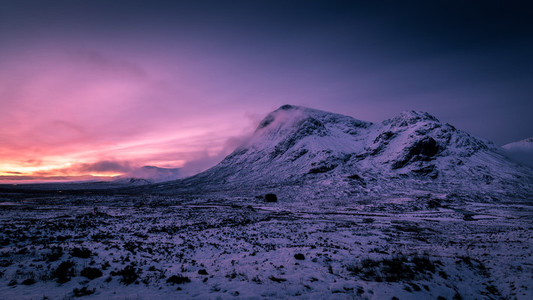 Sunrise winter snow mountain landscape in Glencoe Scotland