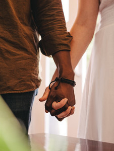 Dating couple holding hands
