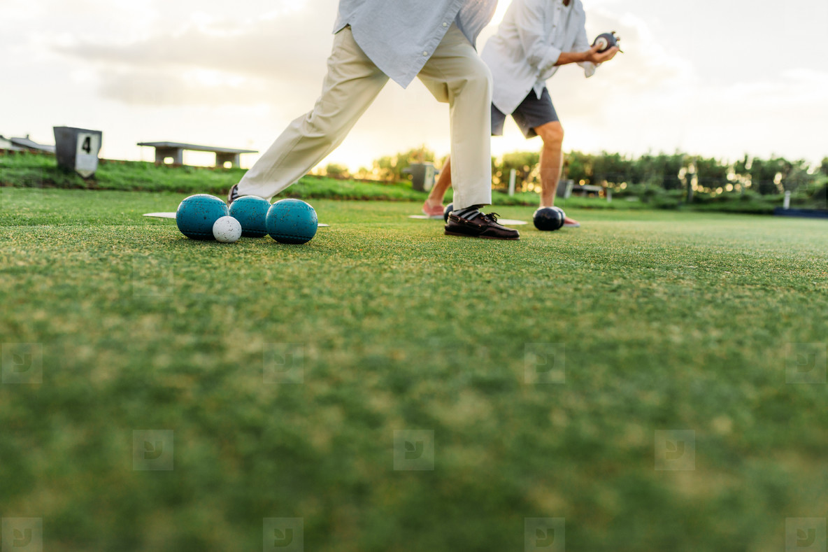 People playing boules in a park