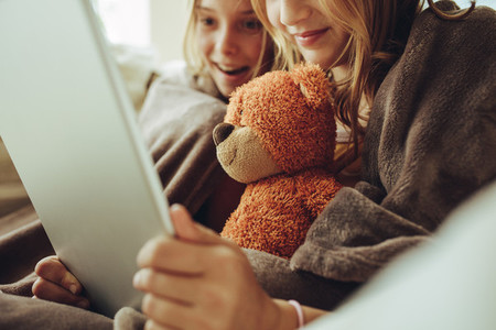 Girls watching a movie on a tablet pc