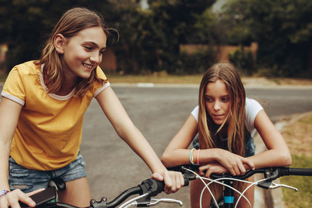 Girls on bicycles in the street