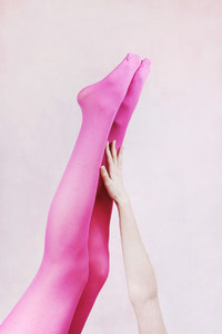 Female legs wearing pink tights