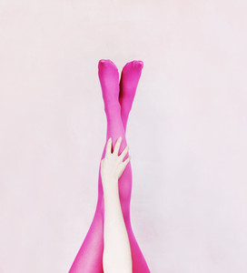 Female legs wearing pink tights