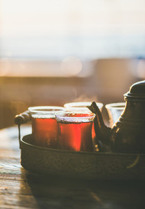 Freshly brewed black tea in turkish tukip glasses  copy space