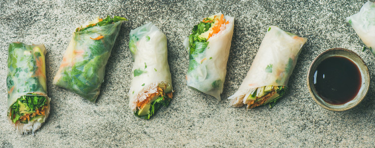 Vegan spring rice paper rolls with chopsticks  wide composition
